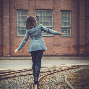 girl walking on the railway